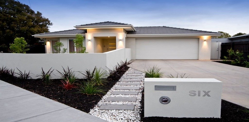 Rendered house façade and front boundary wall